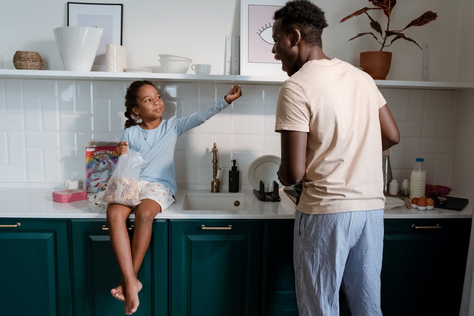 a man and a girl in the kitchen area
co-parenting neurodivergent children