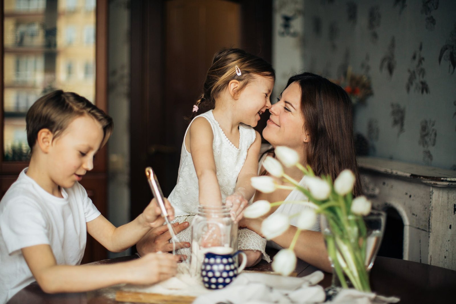 photo of woman playing with her children - radical acceptance