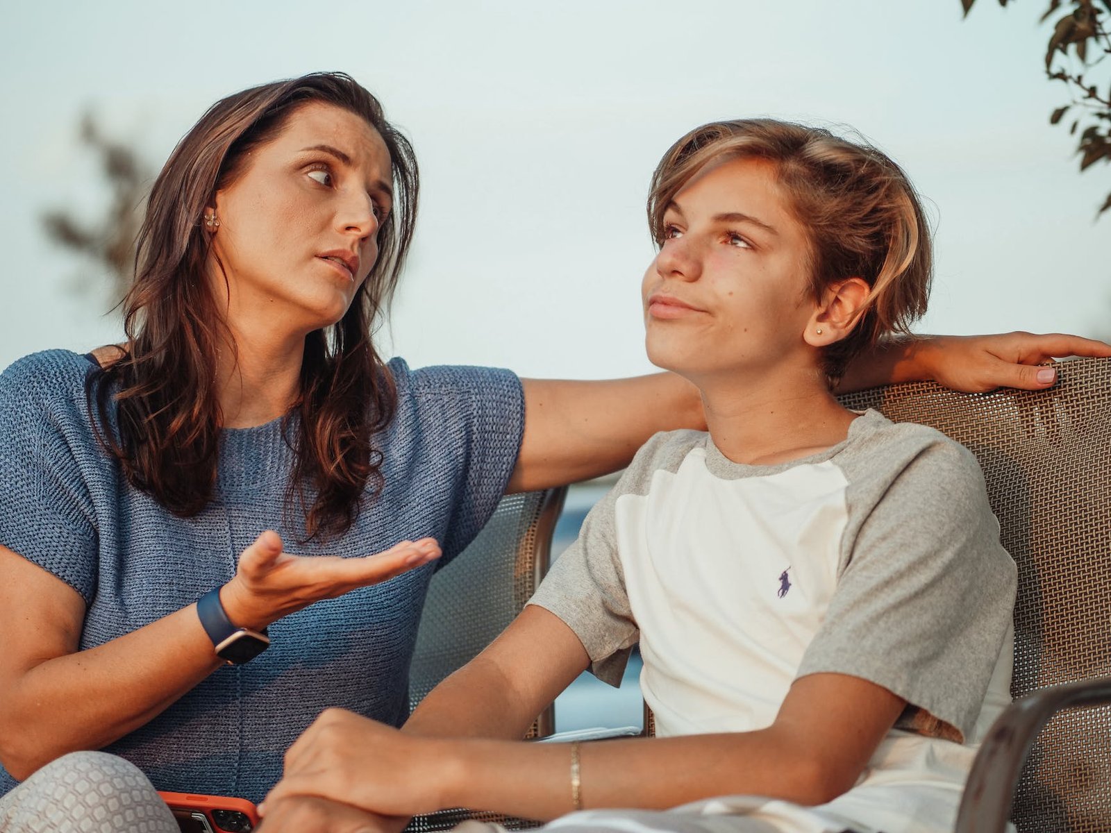 a mother and son having a conversation