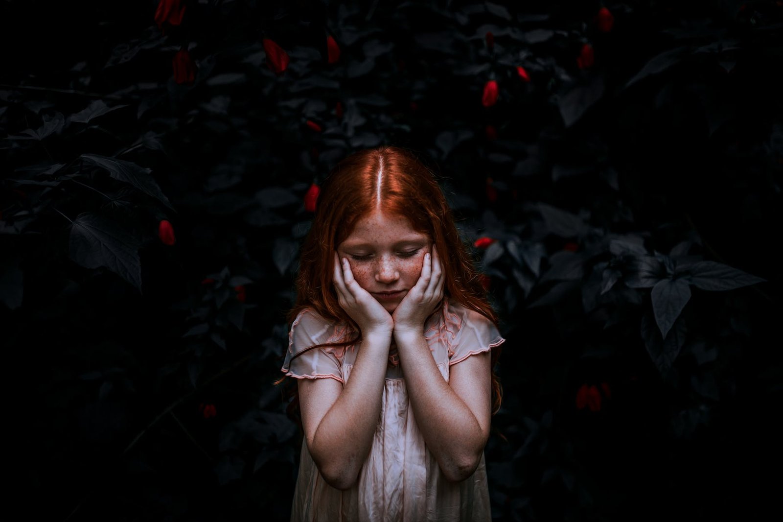 red haired girl standing near plant - Negative impact of masking Autistic and ADHD Girls In Early Childhood