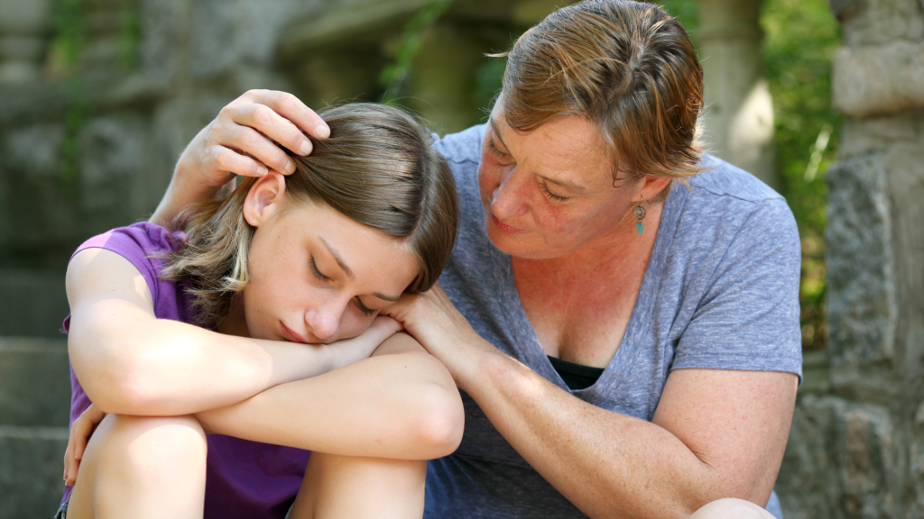 Understanding Autistic Burnout
Mother comforting her teenage daughter