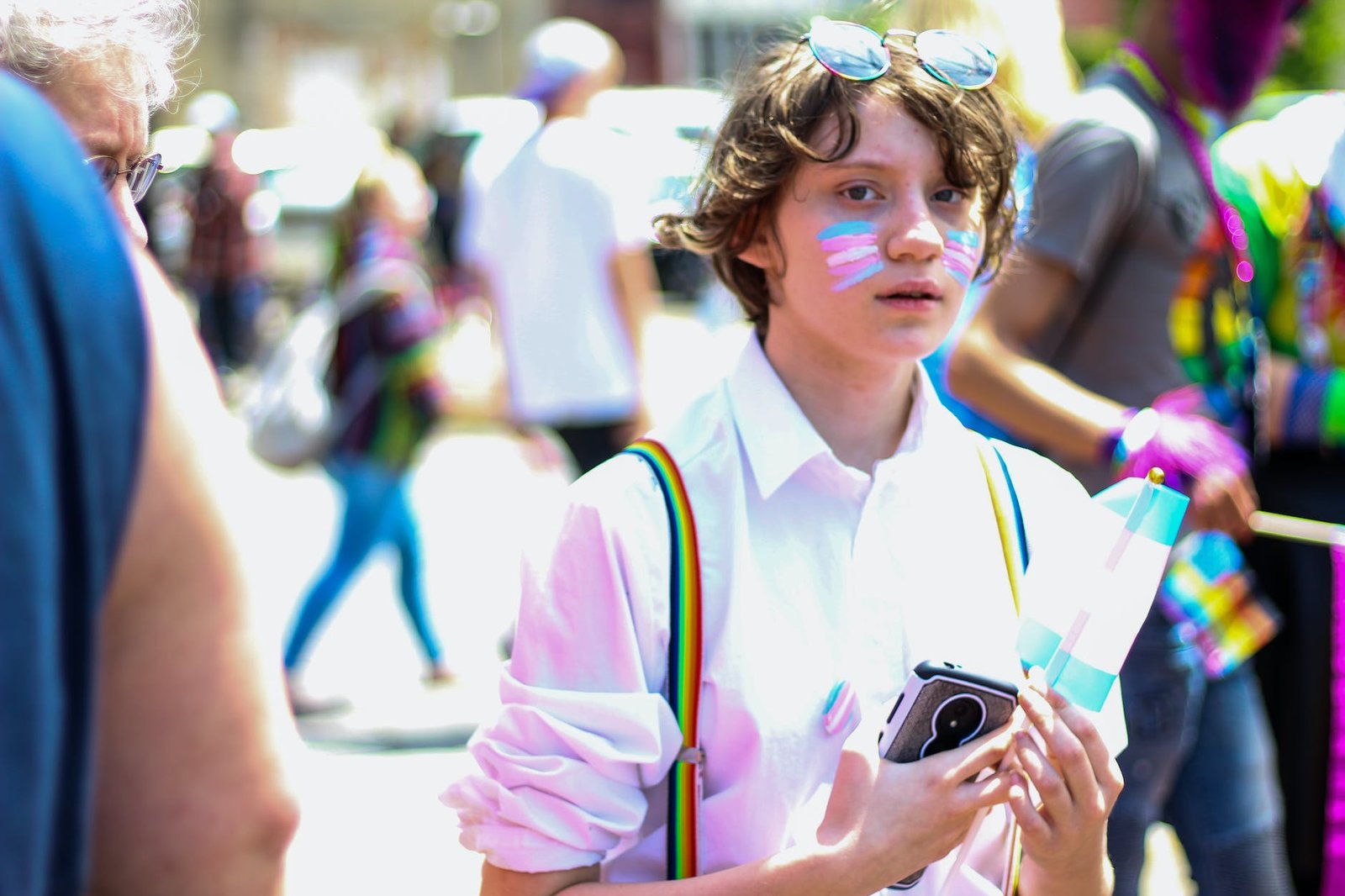 boy holding smartphone and flaglet