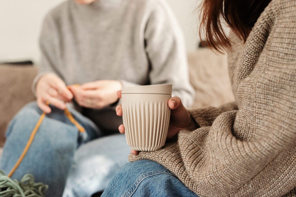 A supportive group for parents having a conversation over a cup of coffee