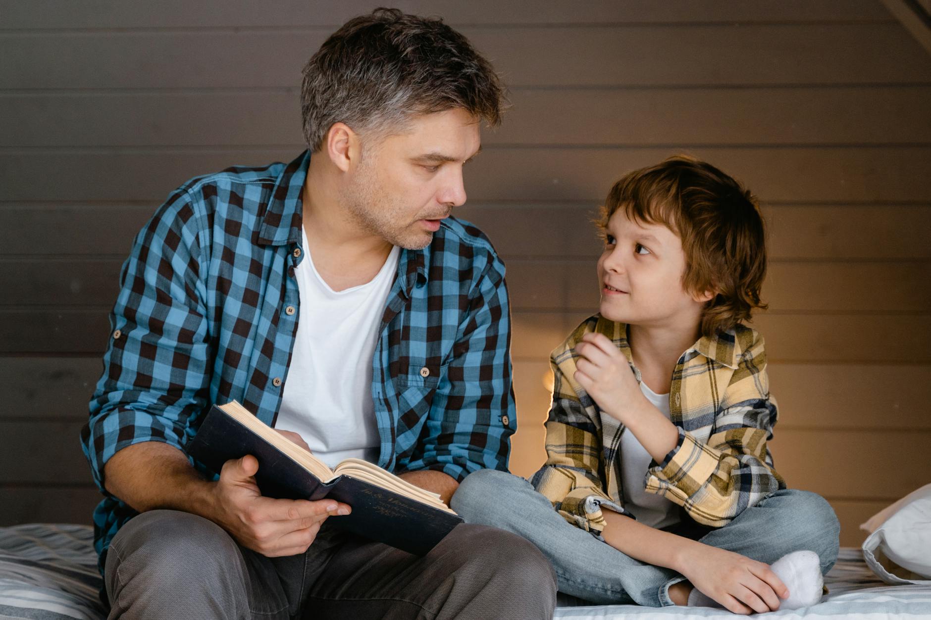 Parent engaging with a child during emotional moment, representing co-regulation and emotional safety