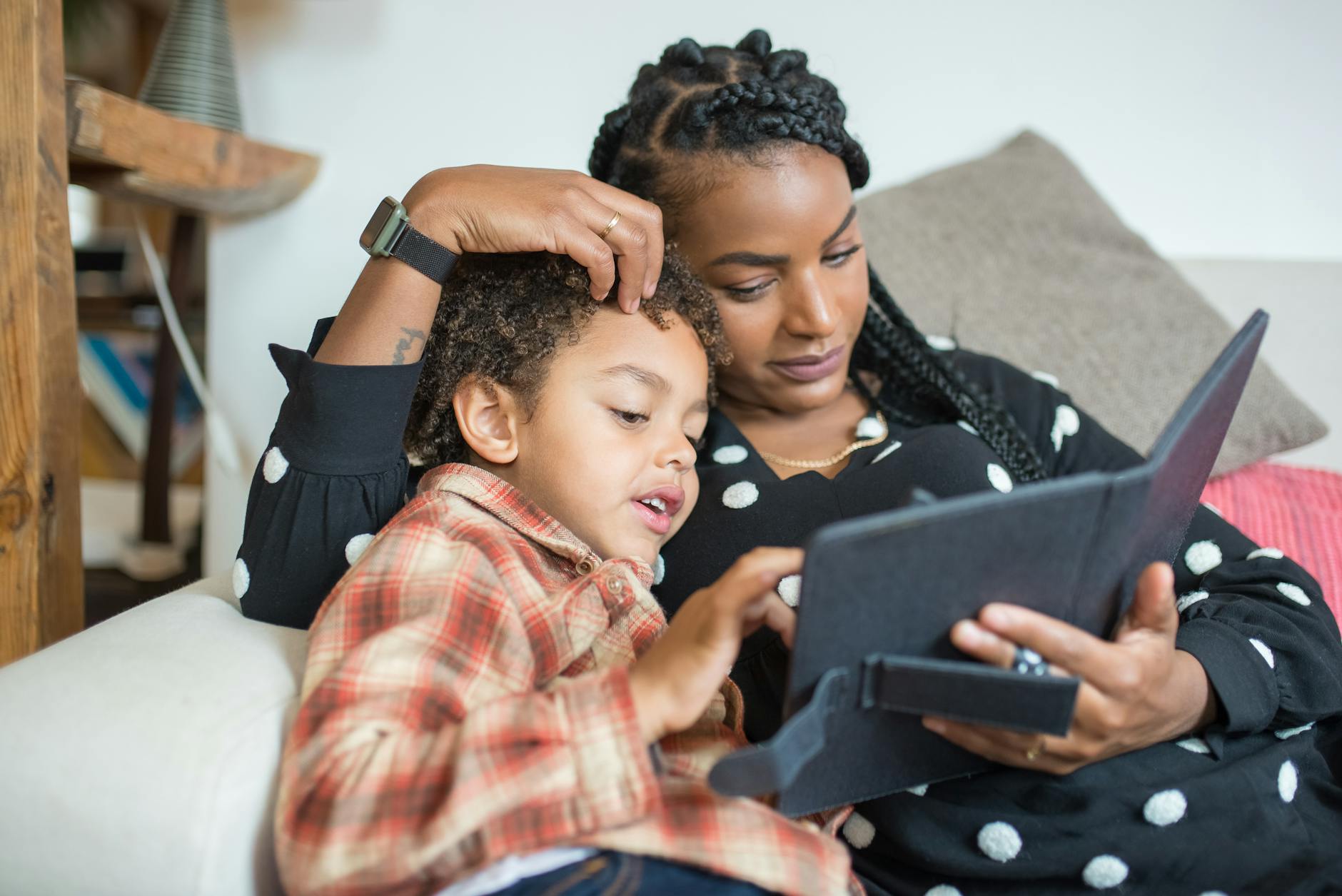 mother and son using a digital tablet - self-care for mothers of neurodivergent children