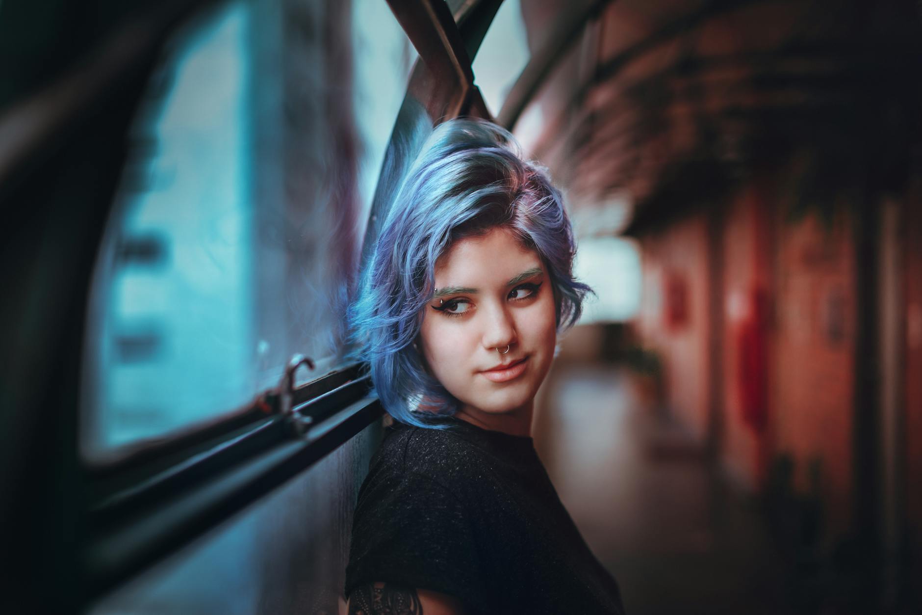 contemplative stylish teenager standing in corridor - Seen on our terms - neurodivergent identity, non-conforming expression, 