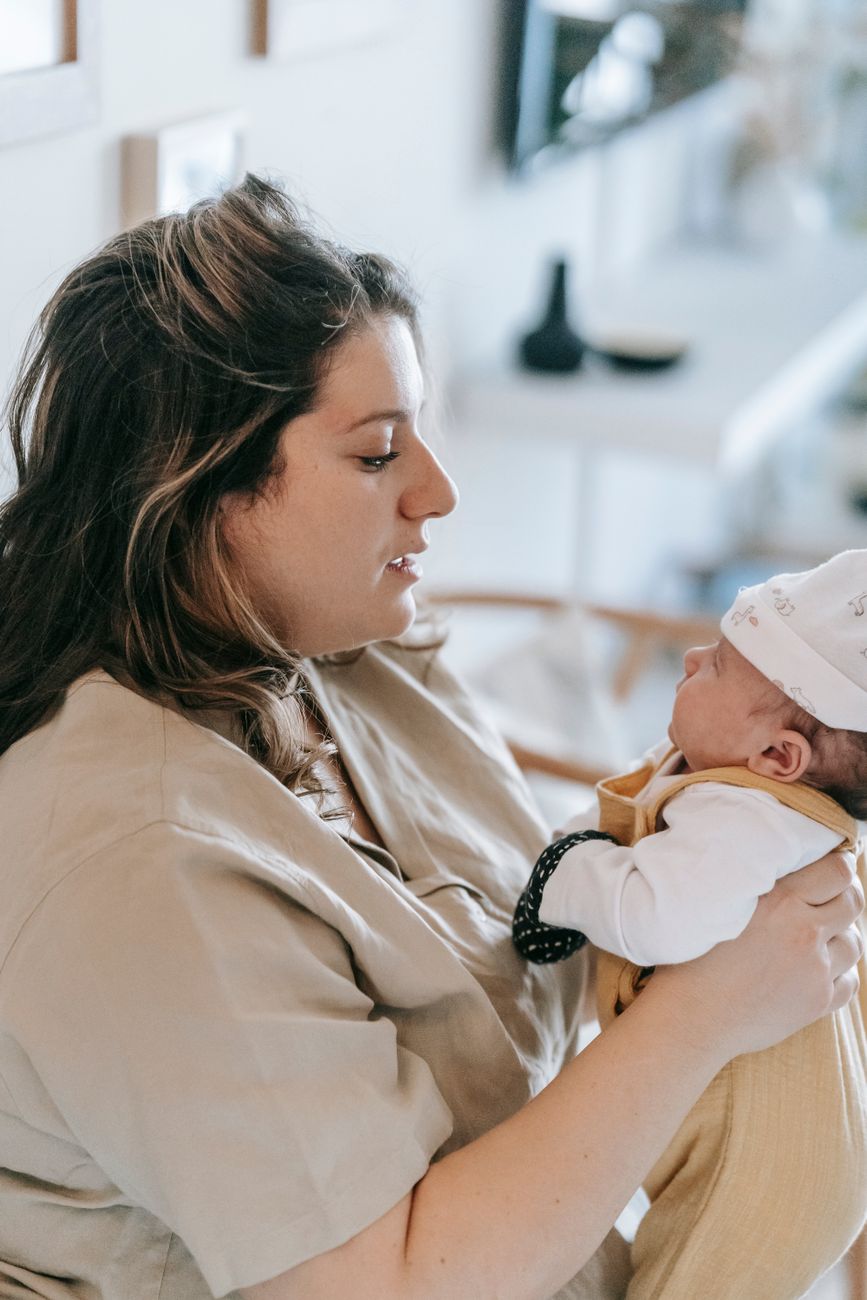 mother with infant baby in arms - Parents of neurodivergent children feeling like they are failing
