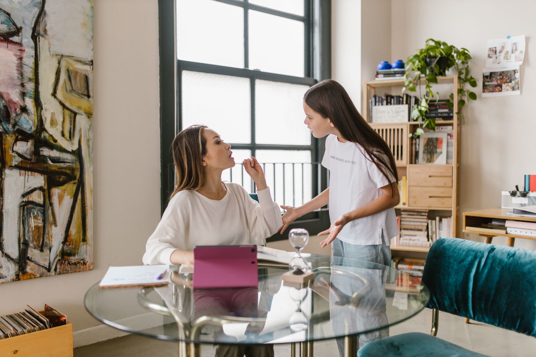 mom and daughter having an argument - a struggling child means a failing parent