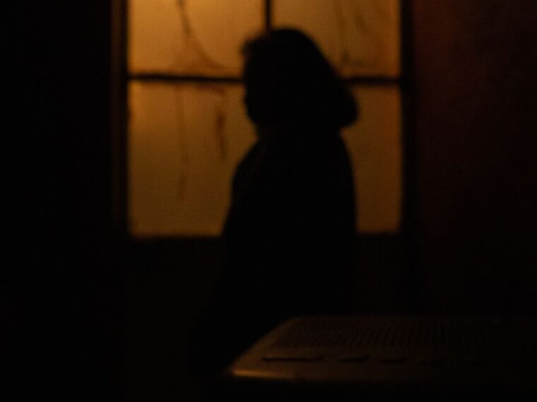 silhouette of woman at night