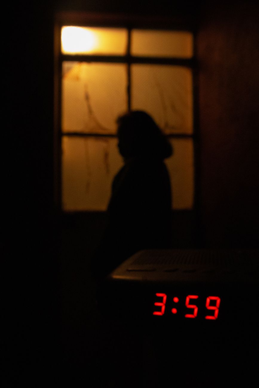 silhouette of woman at night - Stabilising safety in autistic burnout recovery