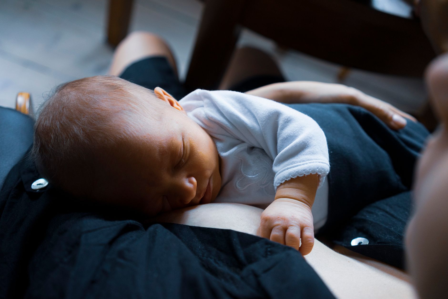 photo of baby on mother s arm - Stabilising safety in autistic burnout recovery
